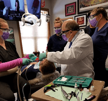Dental assistants training with doctor