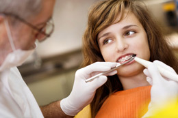 Teeth Braces Chicago - Dentist and Girl with Braces