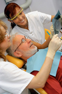 Implants vs Dentures Chicago - Patient Looking at the xray