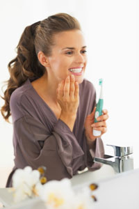 Tooth Extraction Dry Socket Chicago - A Woman Checks Her Teeth