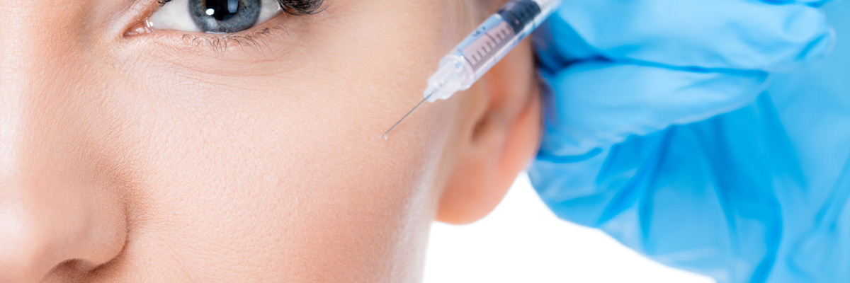 female botox injection on white