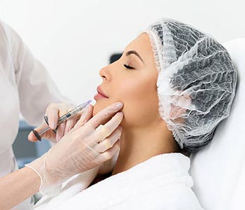 Pretty lady having hyaluronic treatment