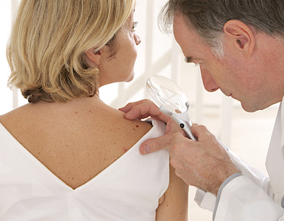 Doctor and Patient - Looking for Skin Disease