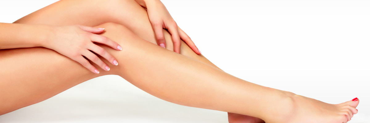 Female legs and hands. Hair removal concept