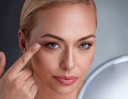 Beautiful woman with mirror