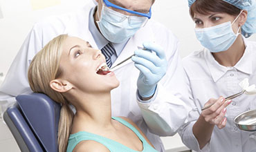 A woman having her teeth checked