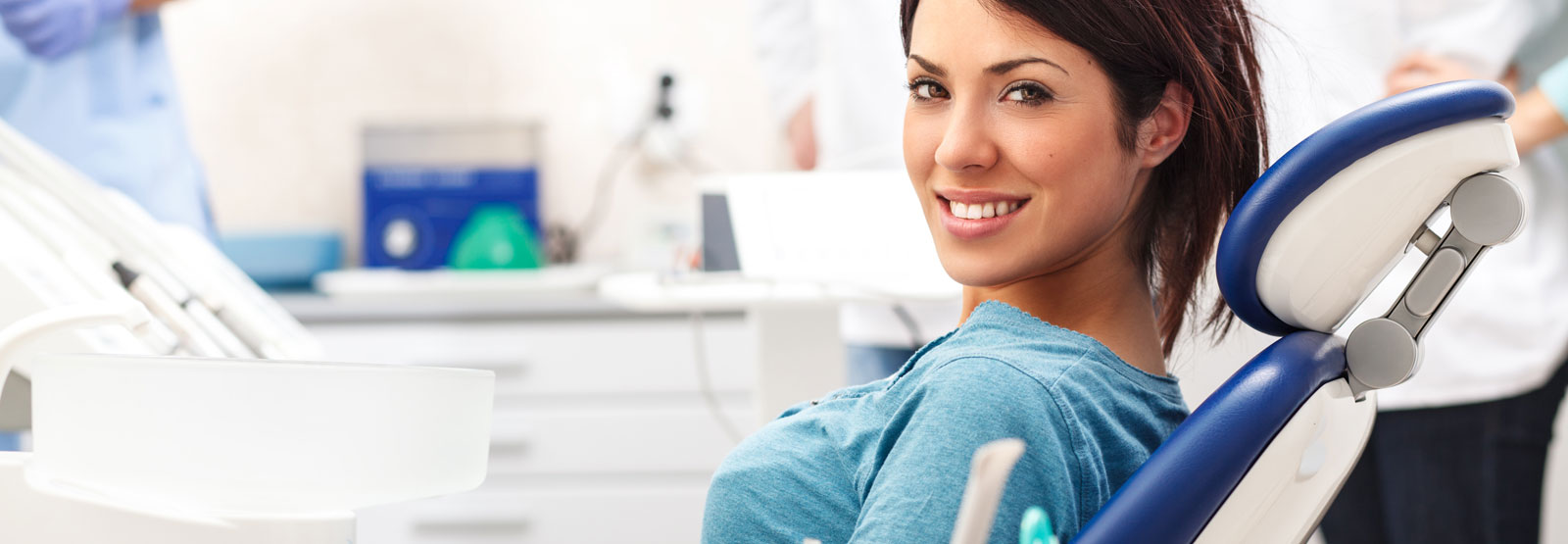 Young female patient sitting on dental chair