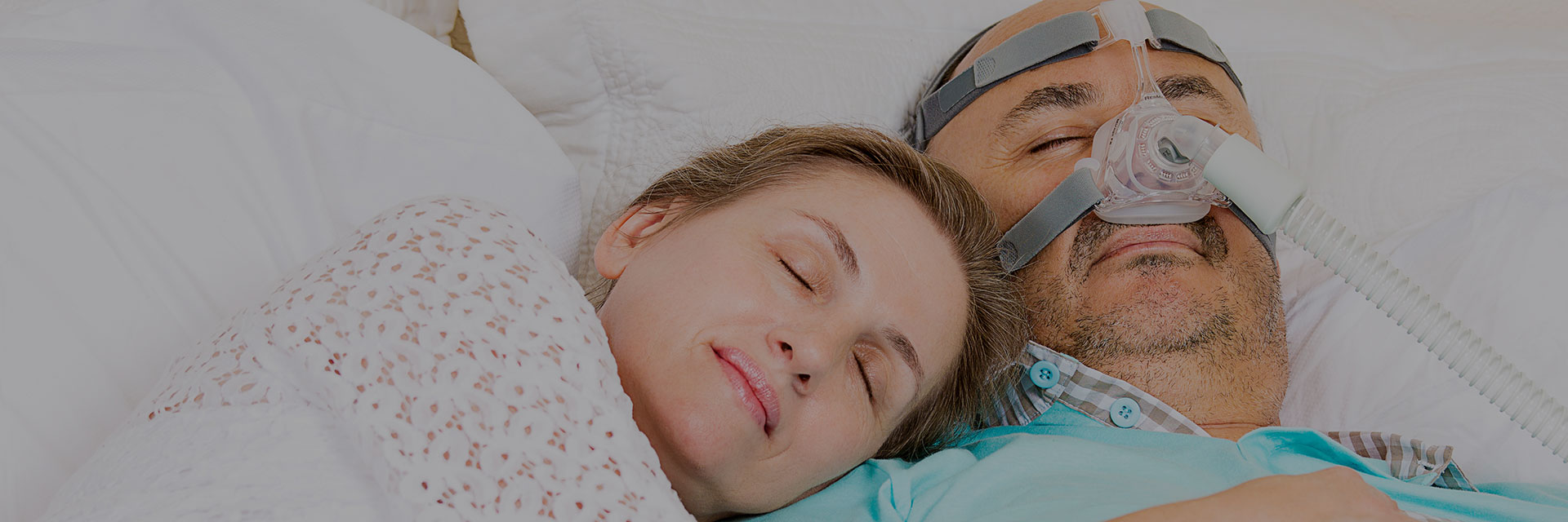 Man with sleeping apnea and CPAP machine