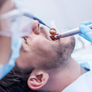 Dentist curing patients teeth