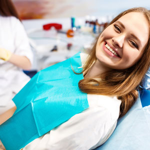 Woman at the dentist's chair during a dental procedure