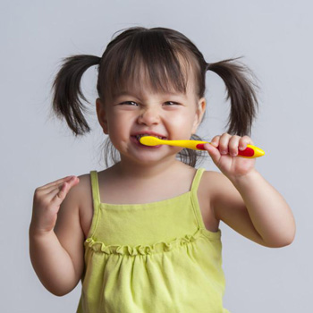 Children brushing teeth