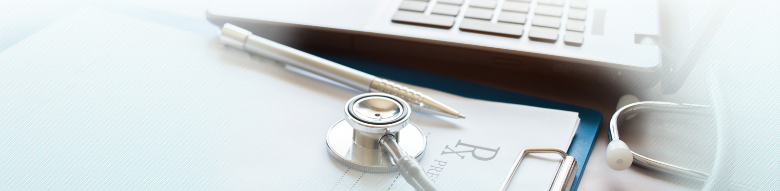 Doctor's working on laptop computer