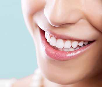 Image of a woman smilling. nice teeth