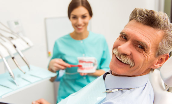Senior man with dentist