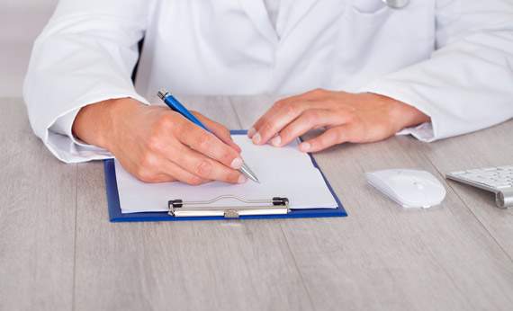 Male Doctor Filling Form