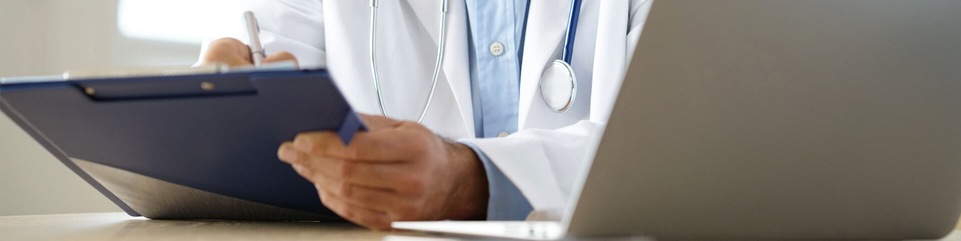 Doctor writing on a statement
