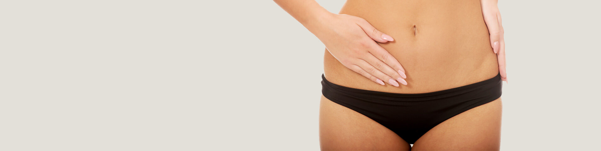Woman touching her slim belly