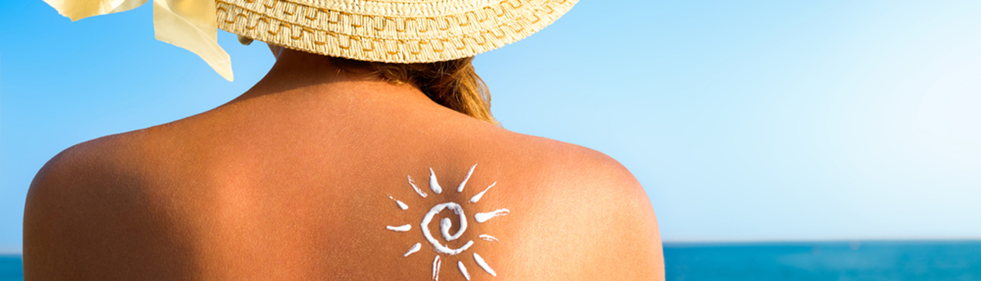 Woman with sunscreen solar cream