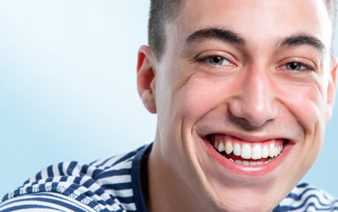 <?php echo $pk;?> - Young man with charming smile.