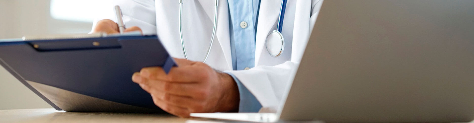 Doctor writing on a statement