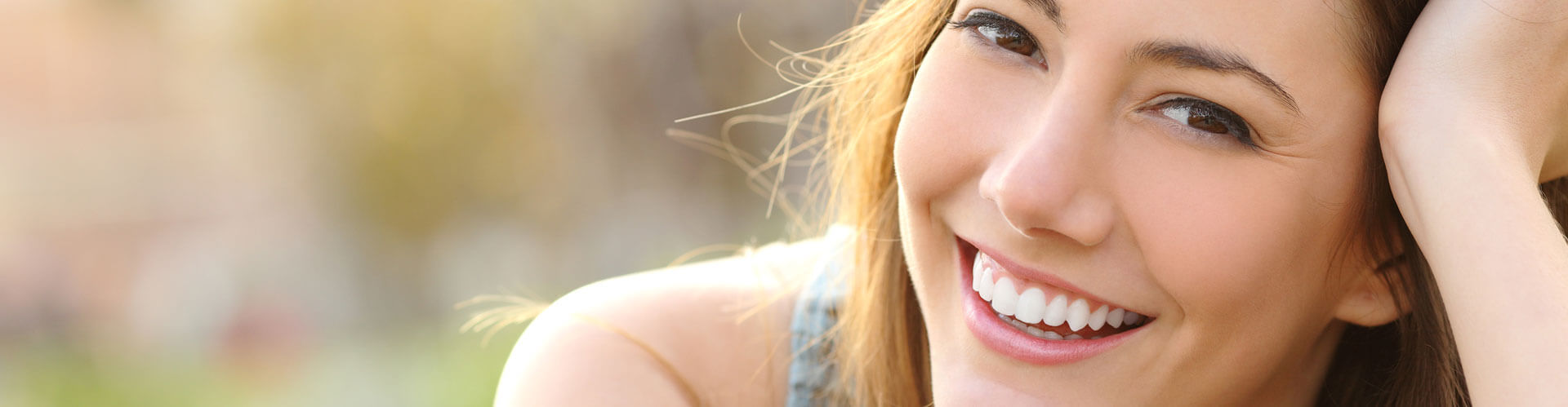 Cropped view of beautiful woman smiling at camera