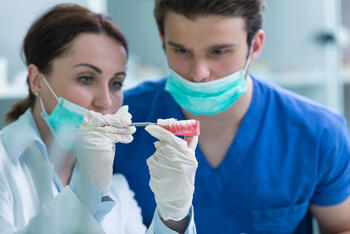 Dental prosthesis working on the denture