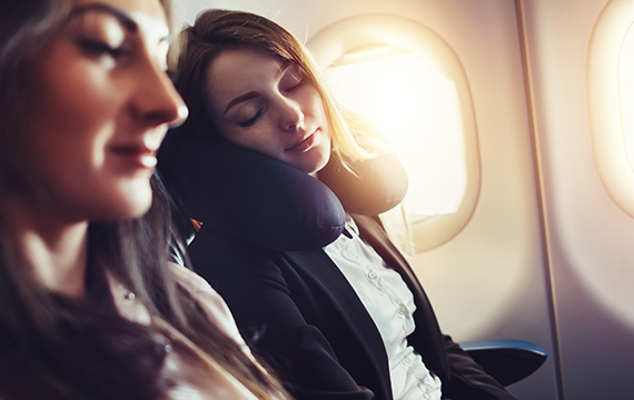 Young Woman Sleeping  inside a flight
