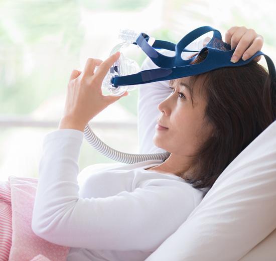 A Woman with CPAP mask