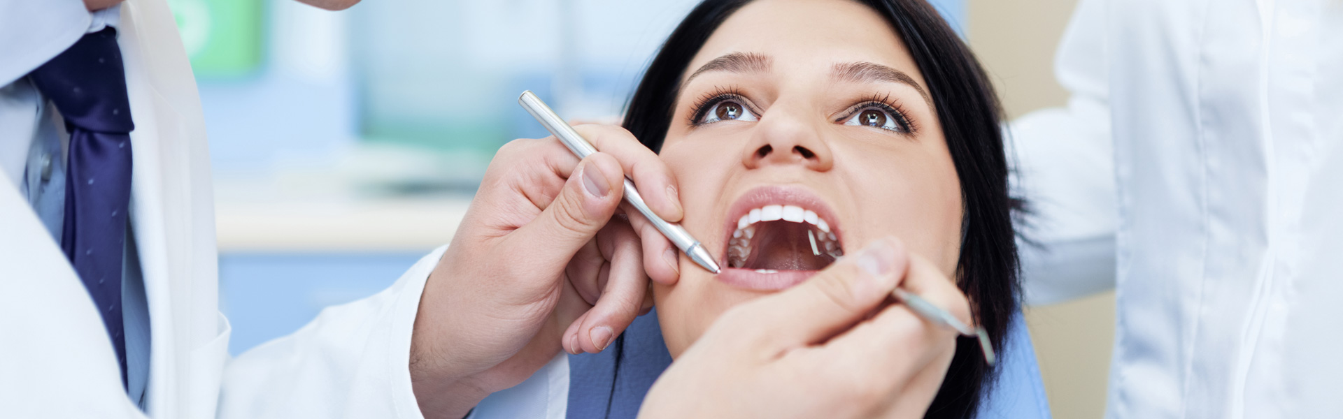 A dentist working with a patient
