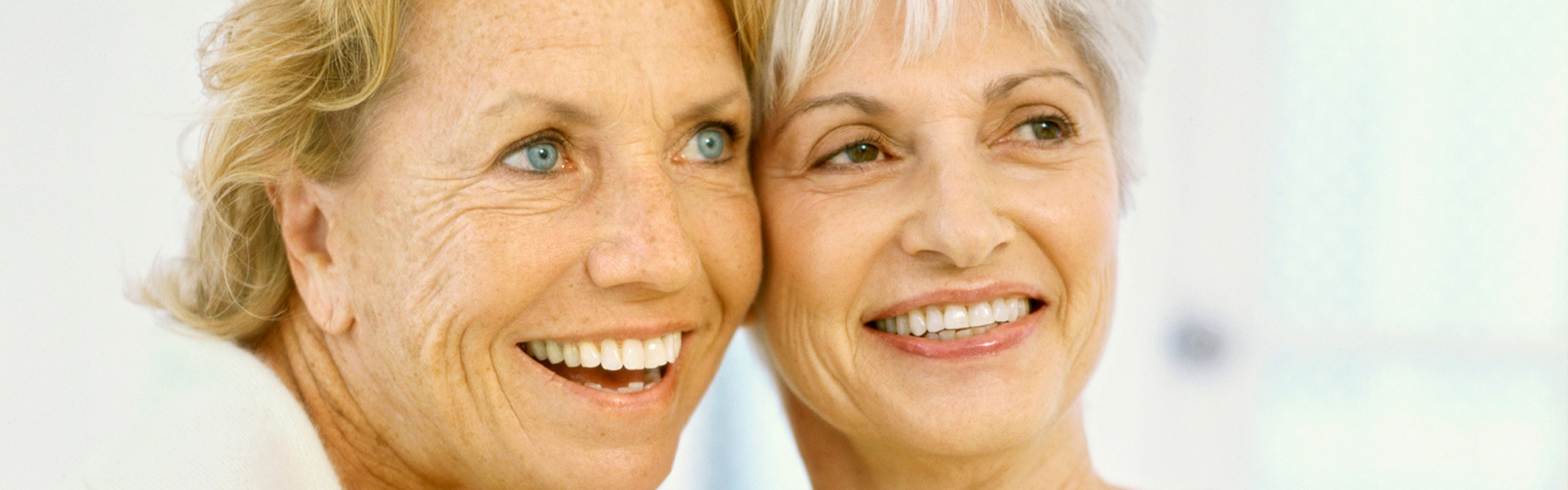 Smiling two elderly women