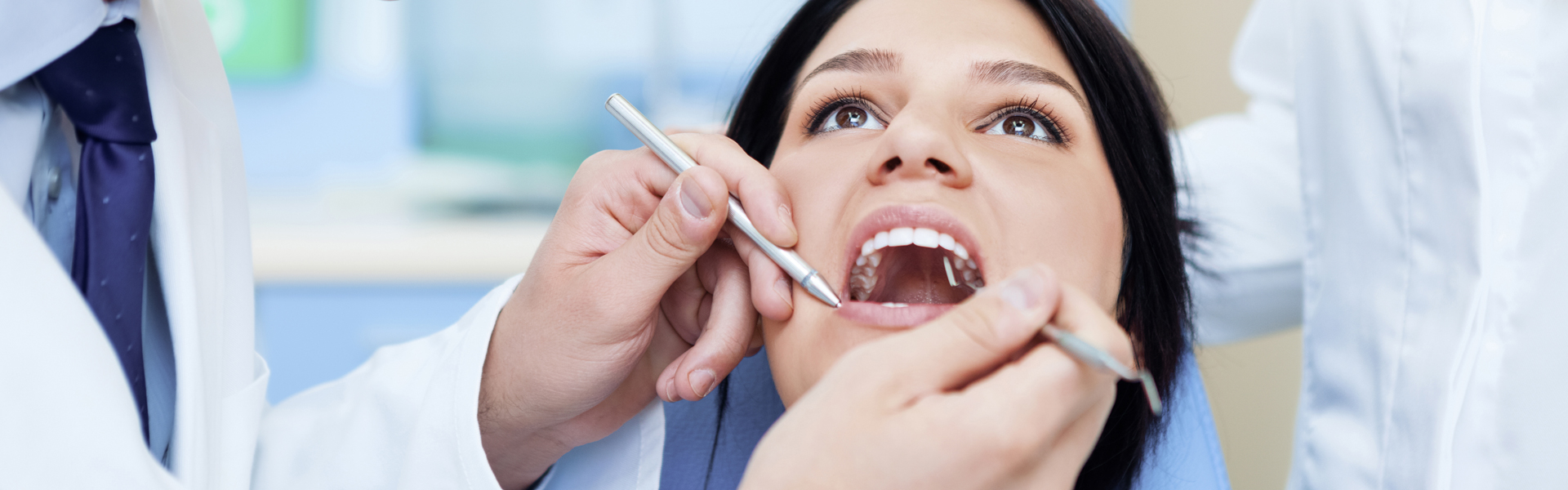 Dentist examining mouth