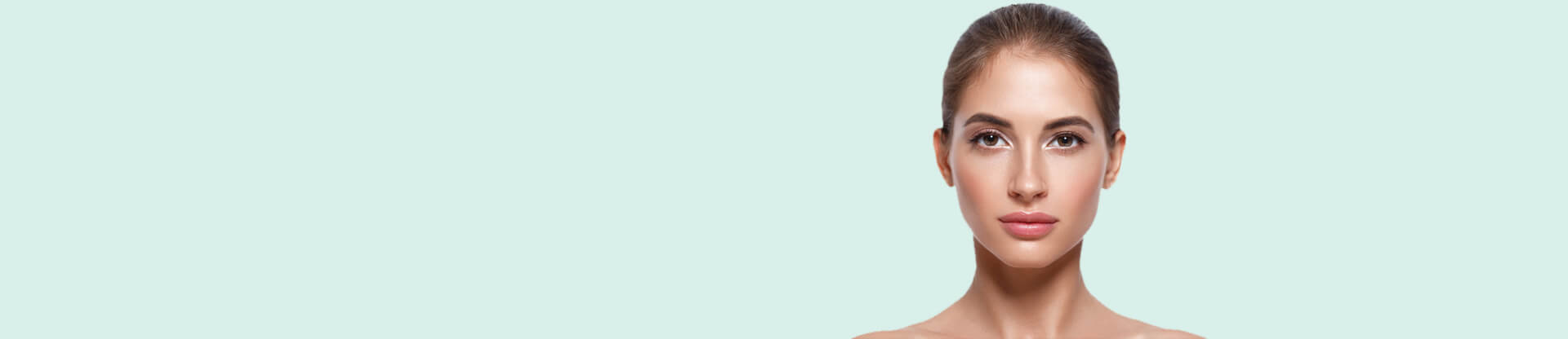 Young beautiful lady with bright skin looking at the camera