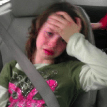 A little girl having headache
