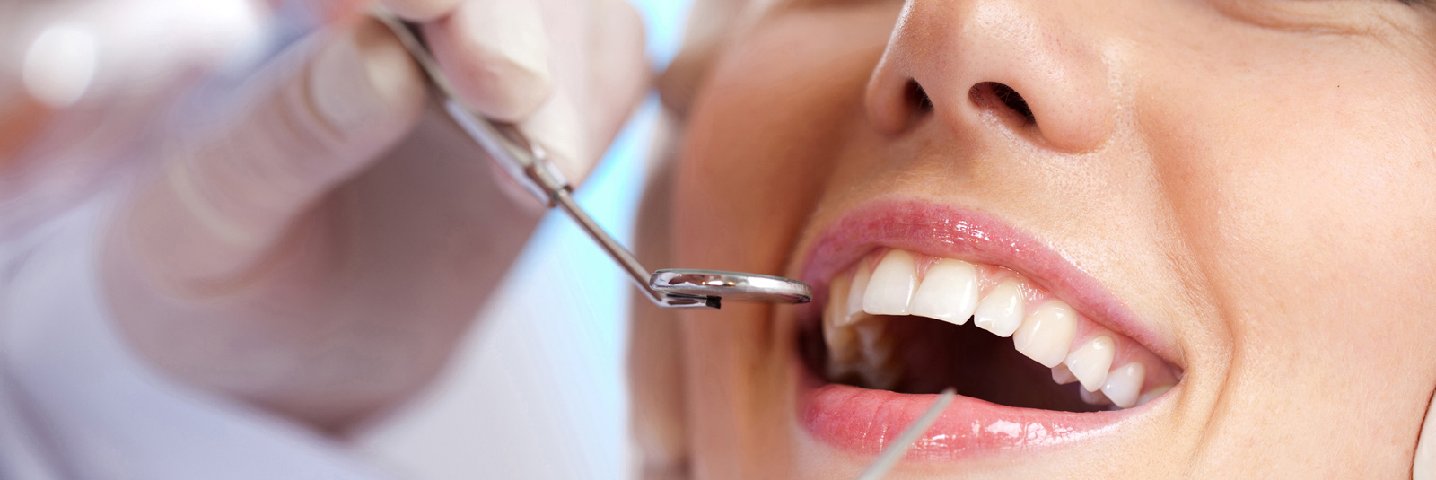 Dentist examining a patient's teeth in the dental office