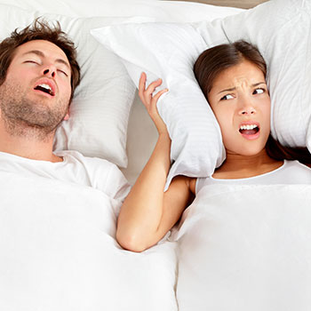 Snoring man - couple in bed