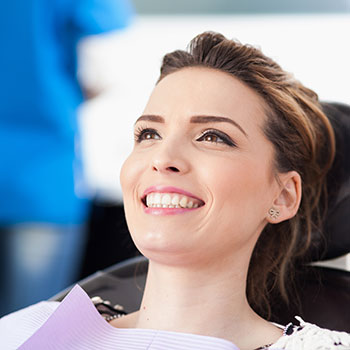 Woman patient at the dentist waiting to be checked up