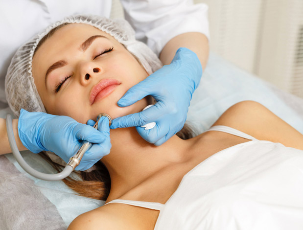 A Woman Recieving Microdermabrasion Treatment