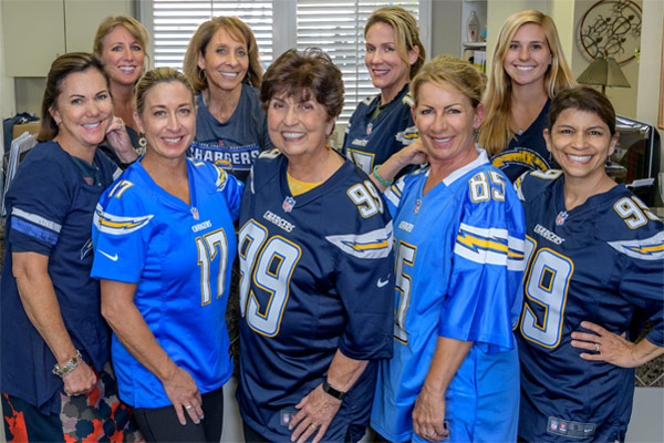 SMILE4OC Staff with LA Chargers uniform