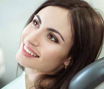 Patient sitting on the dentist chair